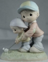 Precious Moments 492140 Dad Teaching Son How to Golf Figurine